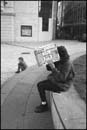 Woman looking into cardboard box